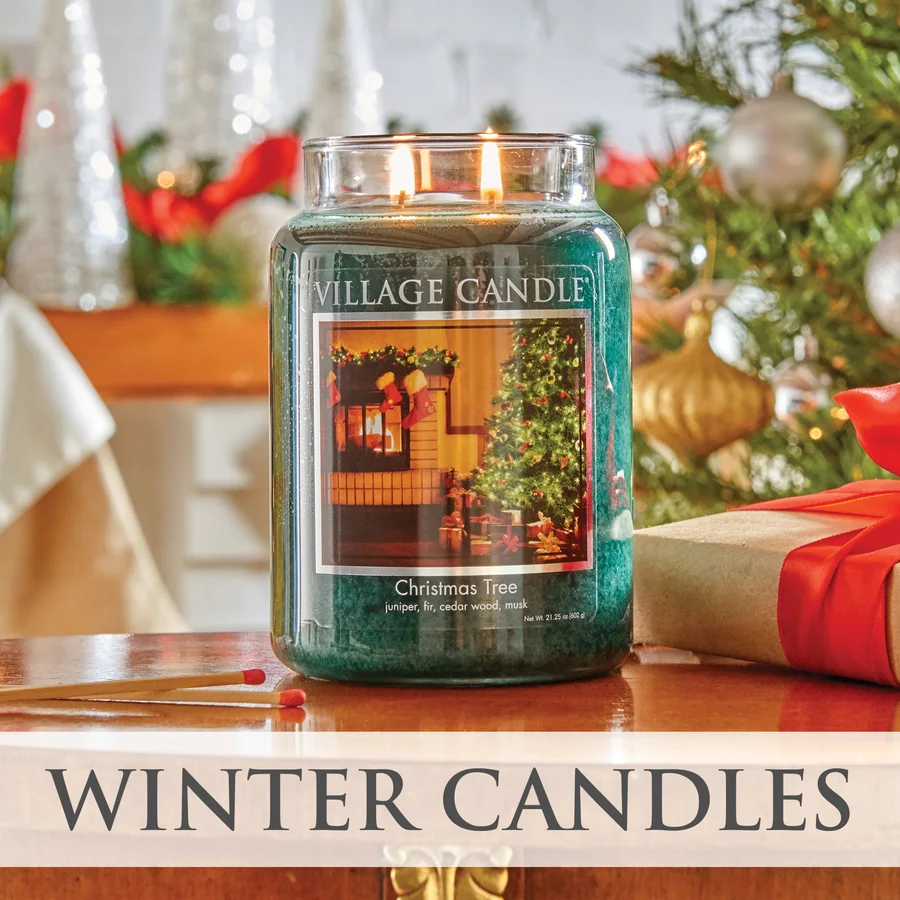 Christmas Tree jar candle in front of a decorated tree, captioned Winter Candles